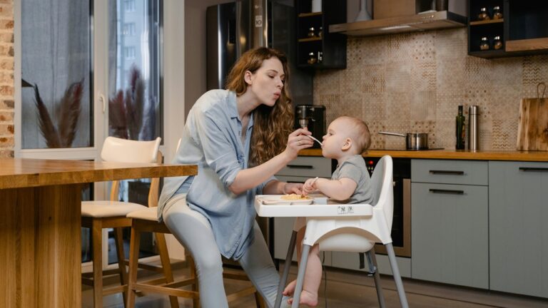 BabyNush Baby Sitting in a High Chair